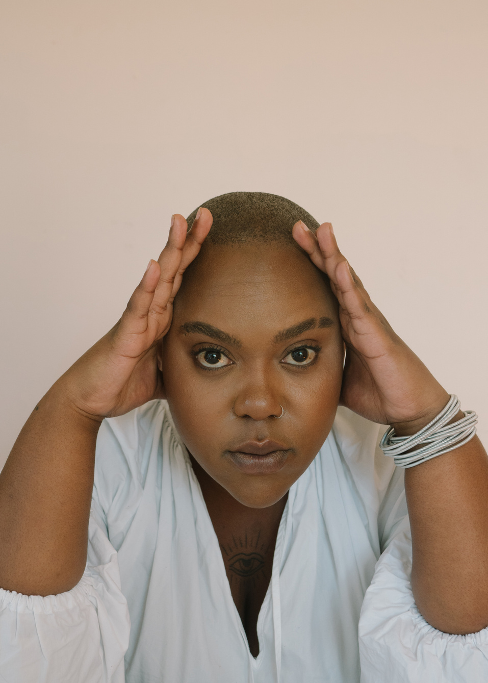 Woman Holding Her Bald Head